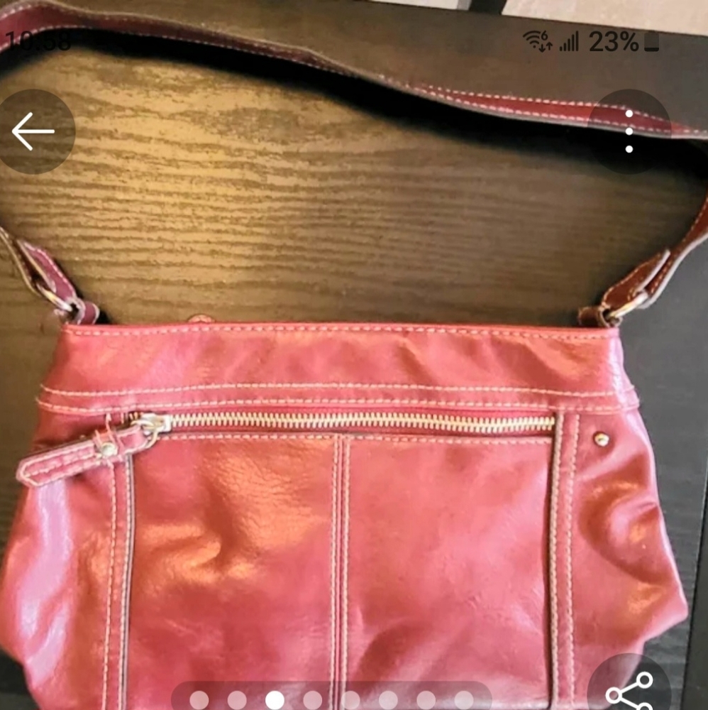 Womans red leather hand purse.